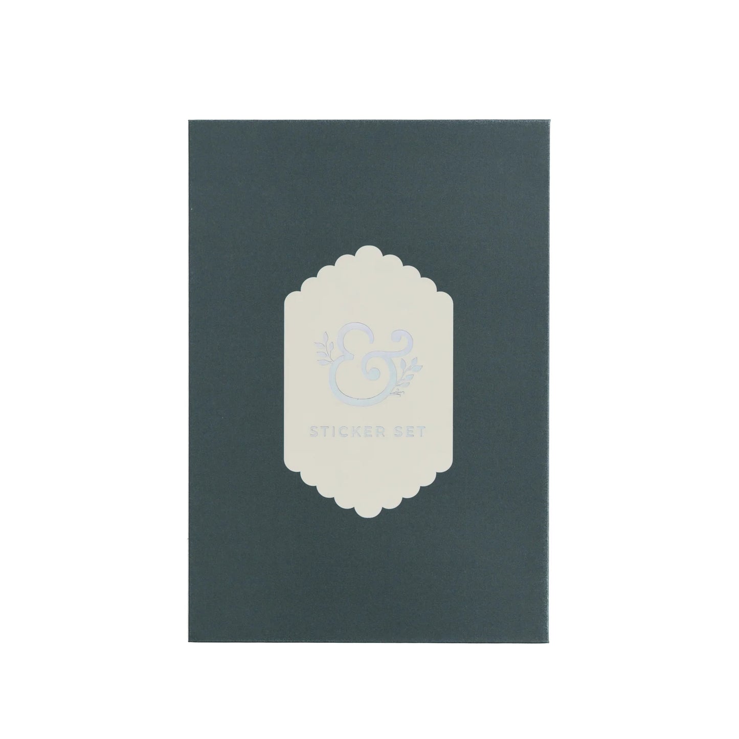 Archer and Olive alphabet sticker packaging. Dark green box with a white decorative label on a white background