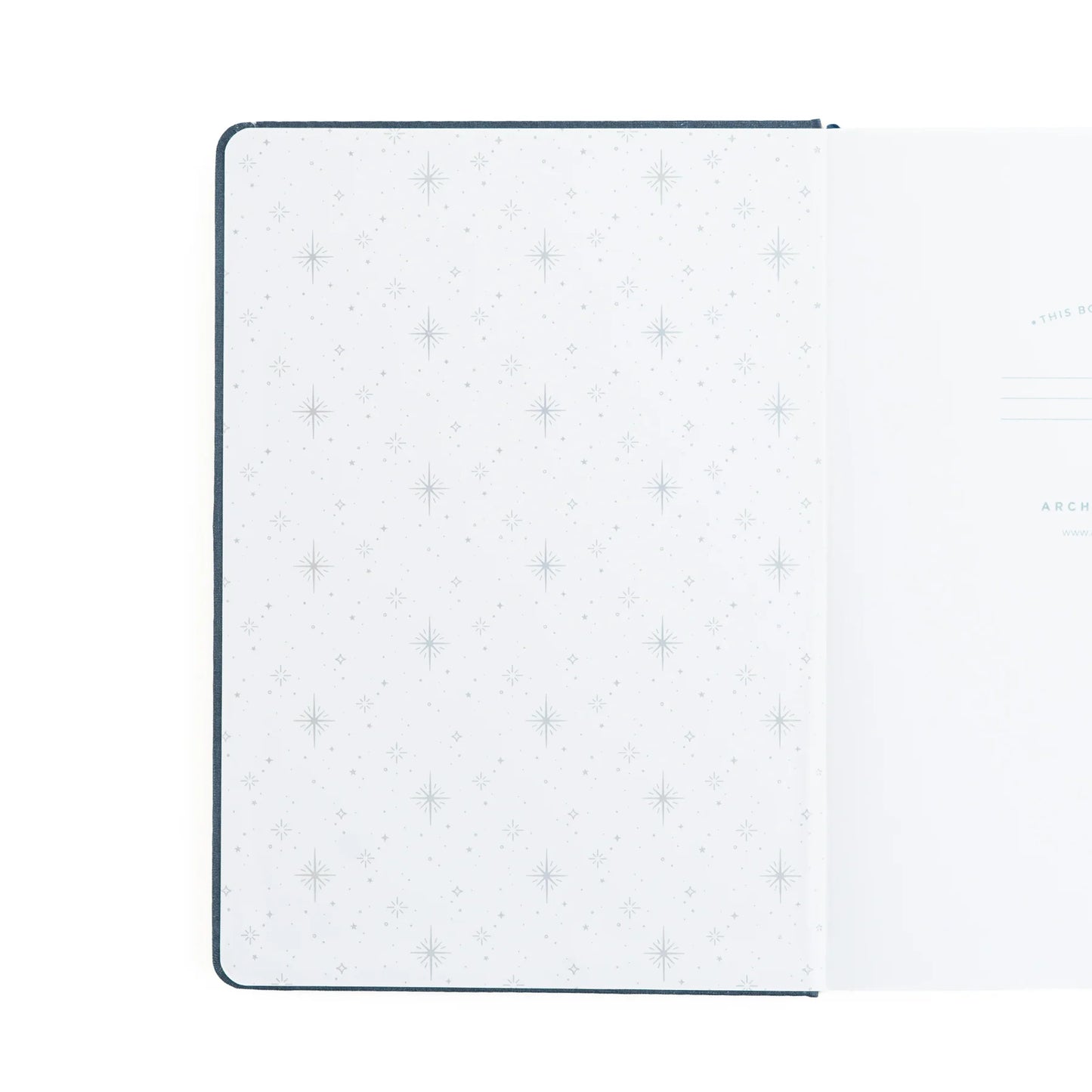 Inside cover of archer and olive starbright notebook featuring sparkle pattern embossed in silver on a white background