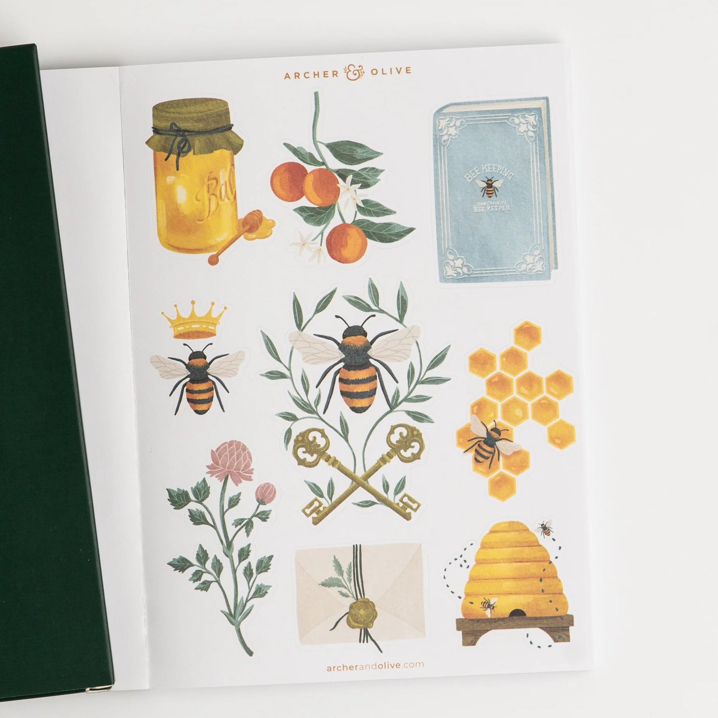 Sheet of decorative stickers with bees, flowers, and a beehive on a white background. This is a sheet in the Archer and Olive Sticker Favorites Pack Volume 1.