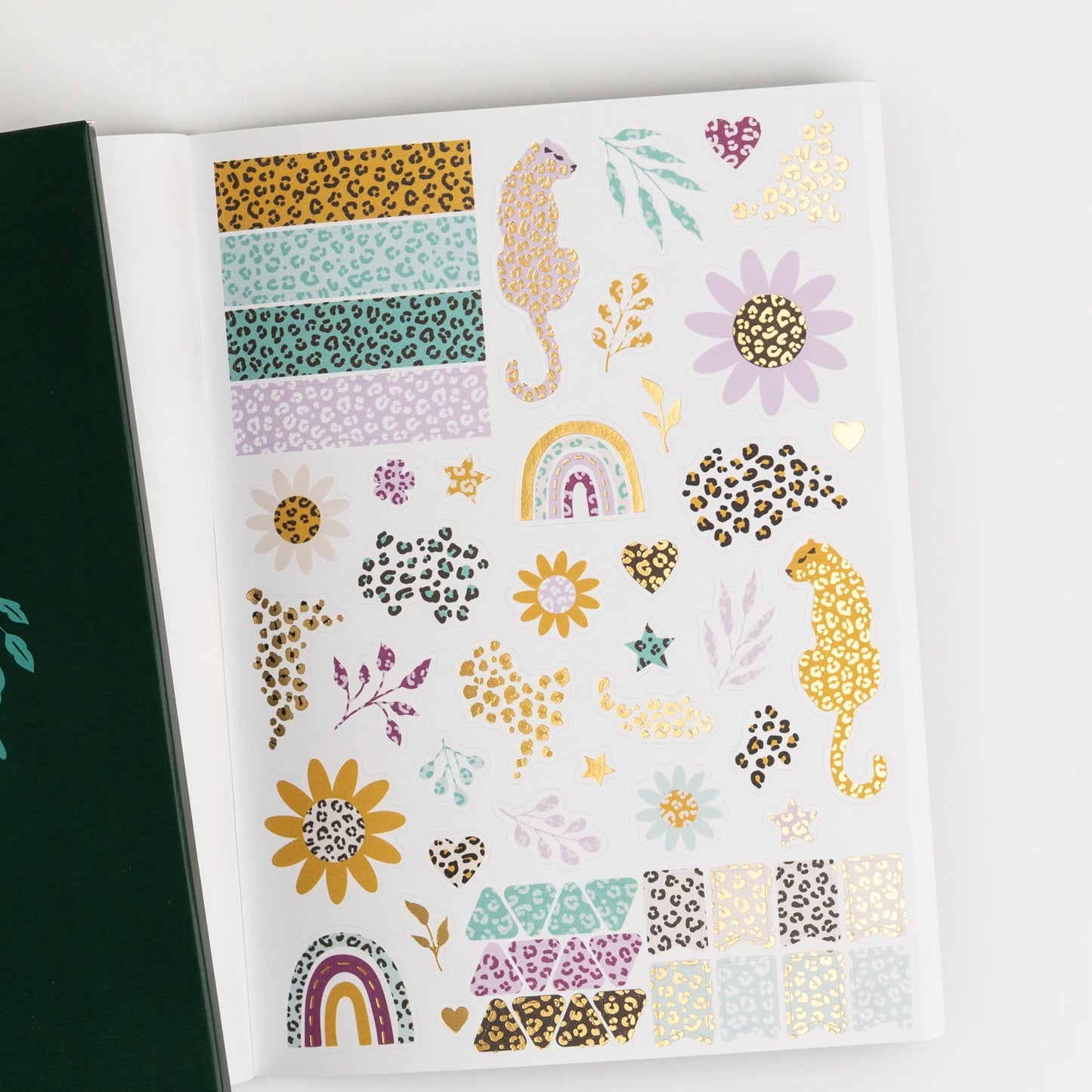 Sheet of decorative stickers with leopard prints, flowers, and patterns on a white background. This is a sheet in the Archer and Olive Sticker Favorites Pack Volume 1.
