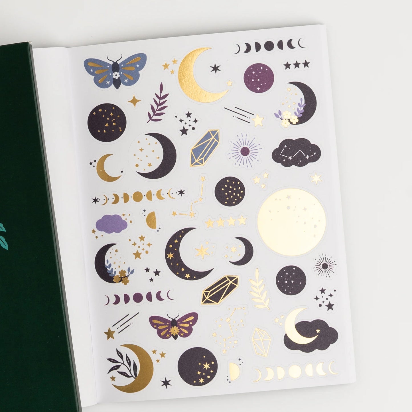 Sheet of celestial-themed temporary tattoos with moons, stars, and butterflies on a white background. This is a sheet in the Archer and Olive Sticker Favorites Pack Volume 1.