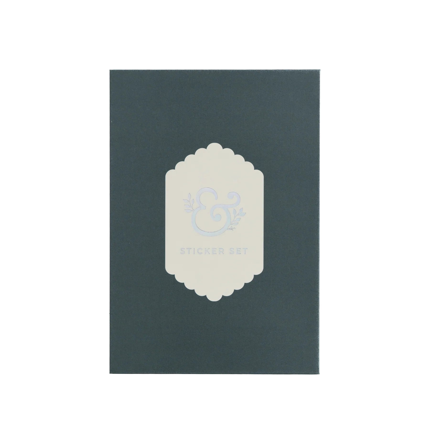 Archer and Olive alphabet sticker packaging. Dark green box with a white decorative label on a white background