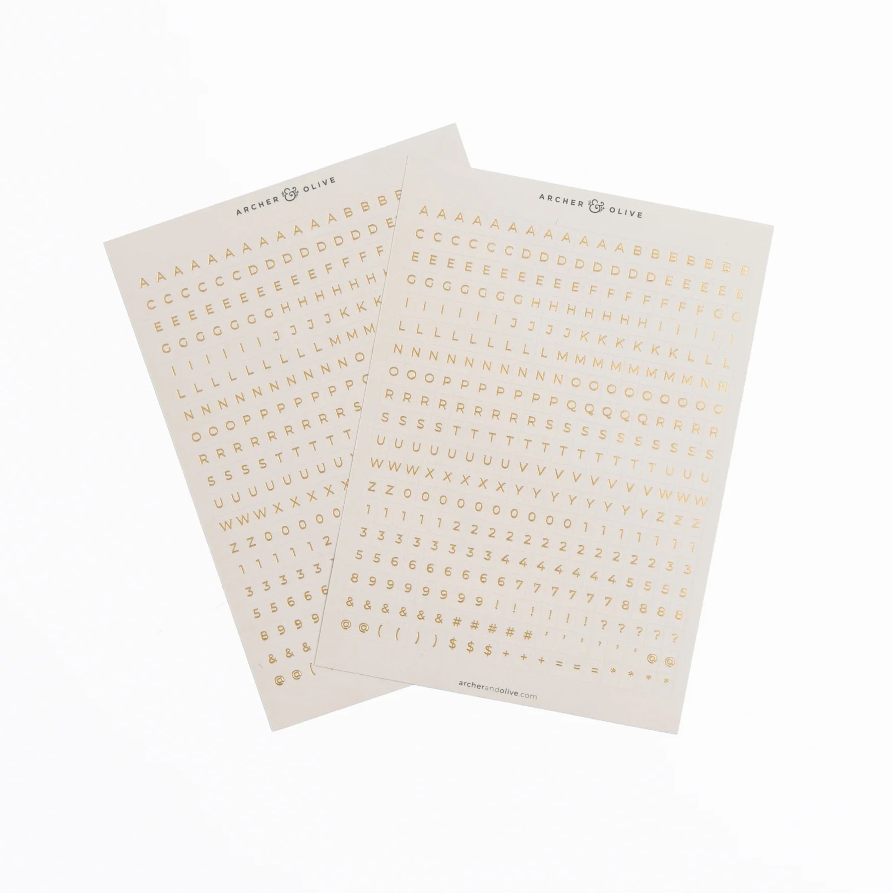 Two sheets of gold letter stickers on a white background
