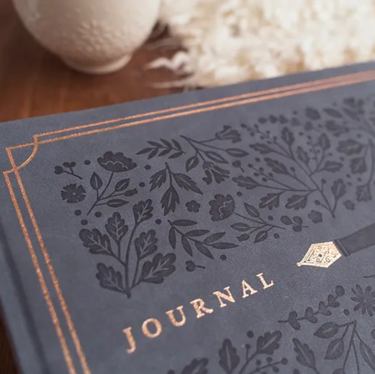 Journal with a pen and floral on navy in gold