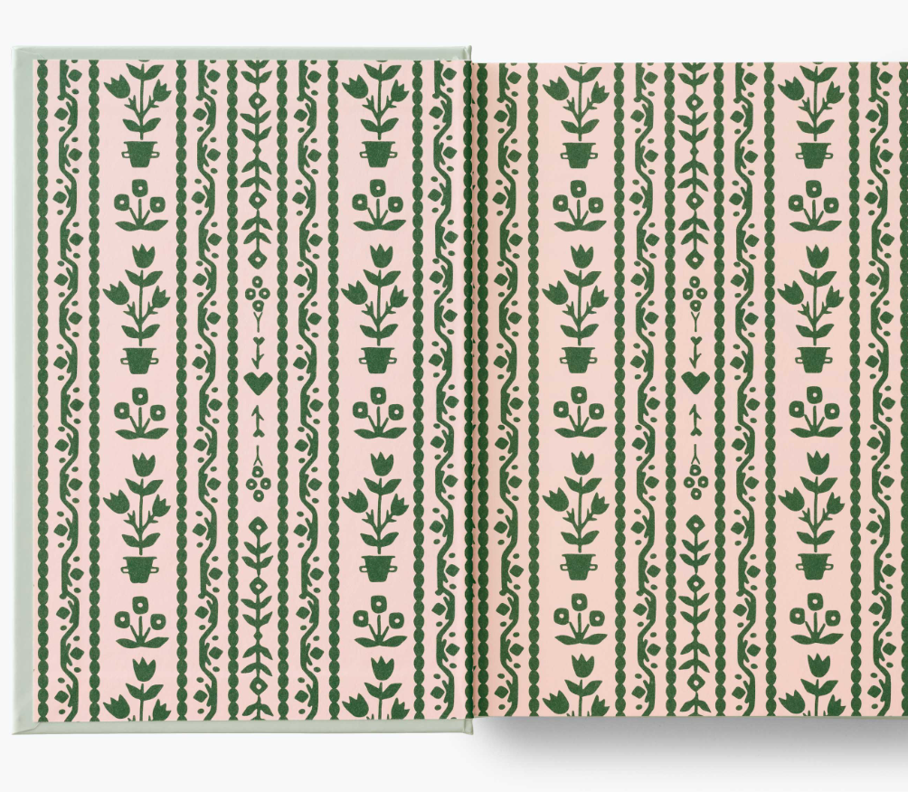 Interior cover with green floral design on a pink background
