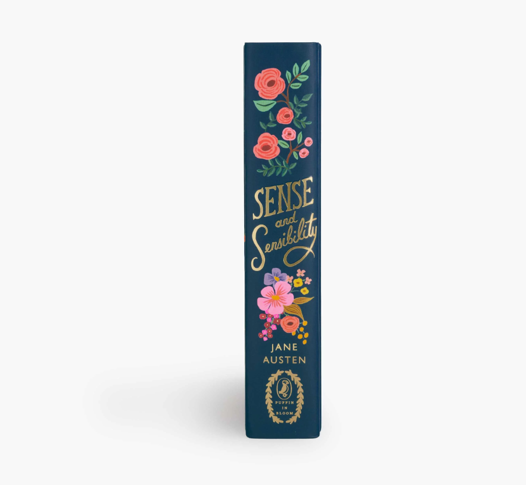 Spine of book showing title 'Sense and Sensibility' by Jane Austen with floral design on a white background. Also captioned Puffin in Bloom.