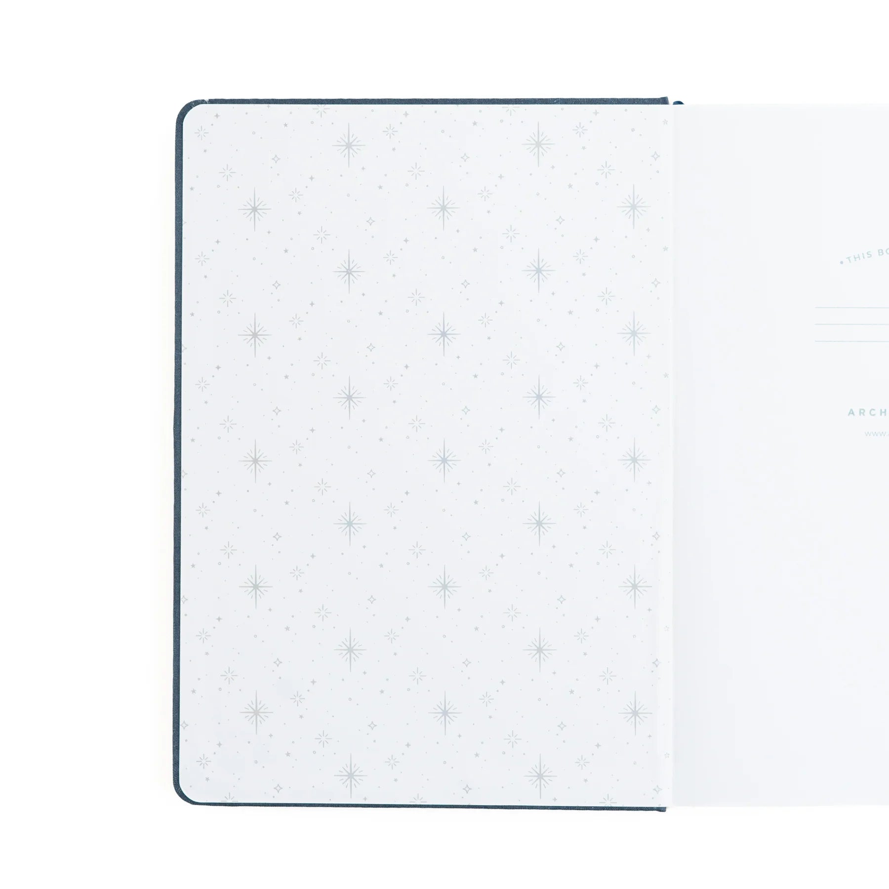 Inside cover of archer and olive starbright notebook featuring sparkle pattern embossed in silver on a white background