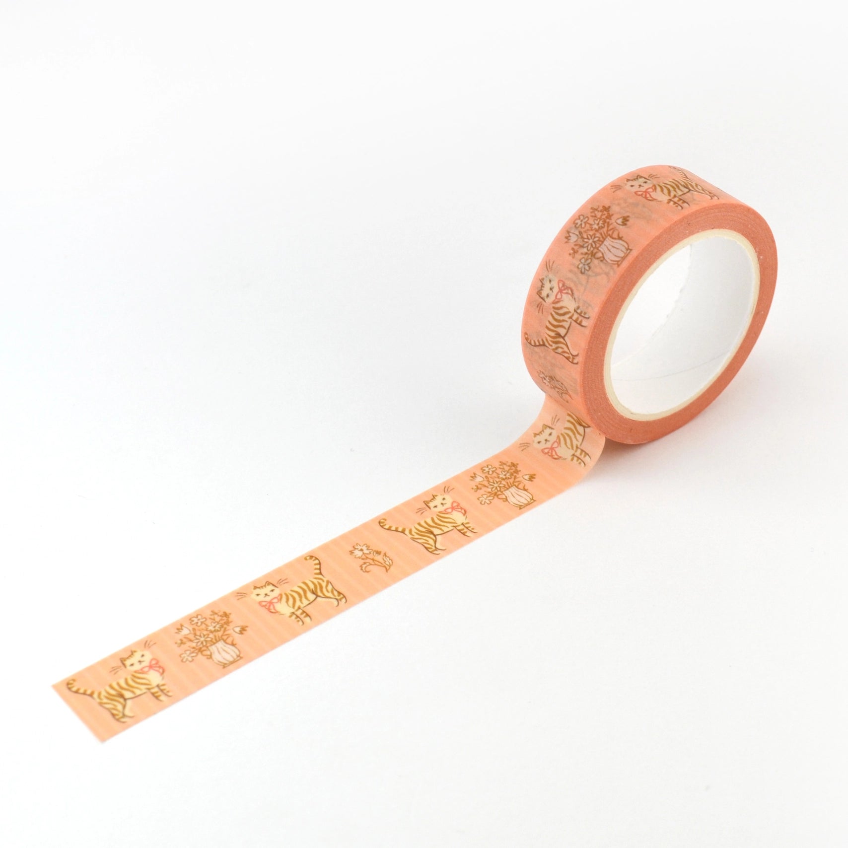 Washi tape in peach with a tabby cat wearing a bow and floral patterns